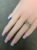 Van Cleef and Arpels Tri-Floral Emerald, Ruby, Sapphire and Diamond Ring, 18K