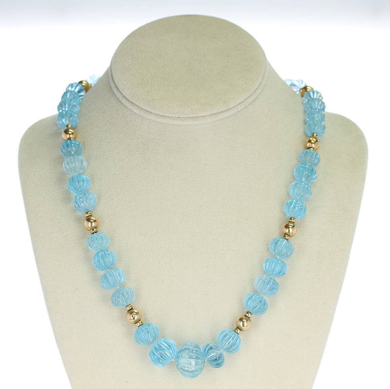Carved Blue Topaz Necklace with Gold Beads